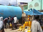 People queue in Harar with yellow jerry cans for water